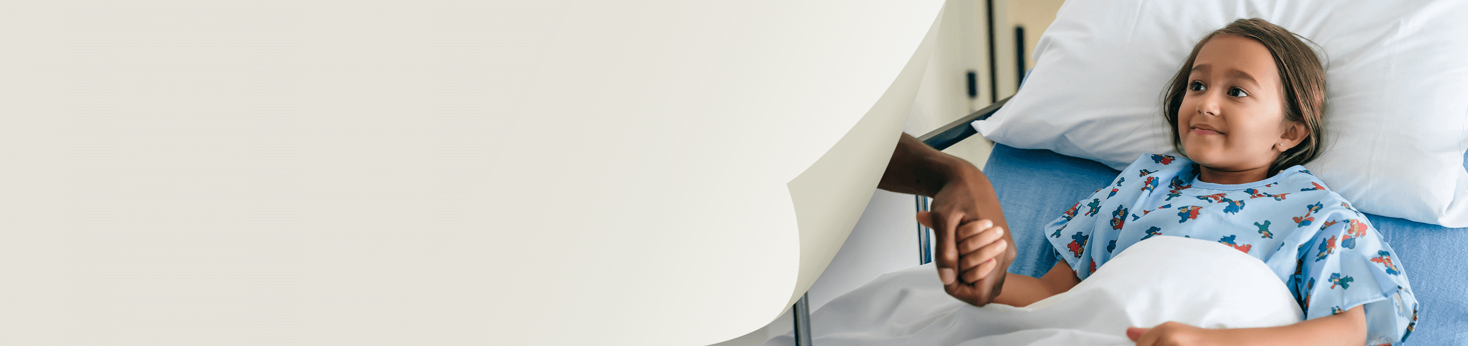 Young patient in a hospital bed under observation, illustrating the safety profile of DEFINITY®