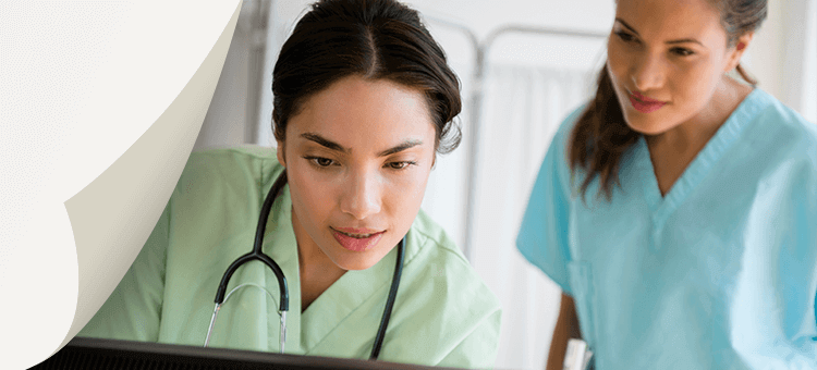 The Challenges of Nondiagnostic Echos and Obtaining Diagnostic Echos Two healthcare professionals reviewing cardiac ultrasound data on a computer in a hospital setting