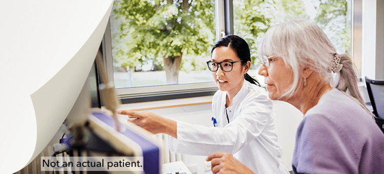 Two healthcare professionals discussing webinar content on a computer, highlighting the educational benefits of DEFINITY®