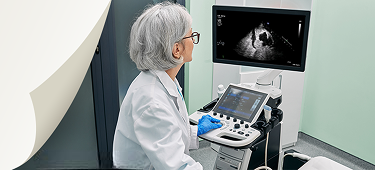 Healthcare professional administering an ultrasound using DEFINITY® on a patient in a clinical setting