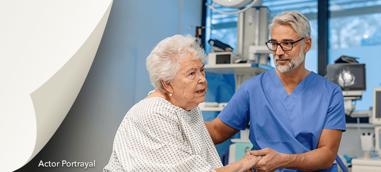 Healthcare professional providing personalized care to an elderly female patient after using DEFINITY® in a clinical environment
