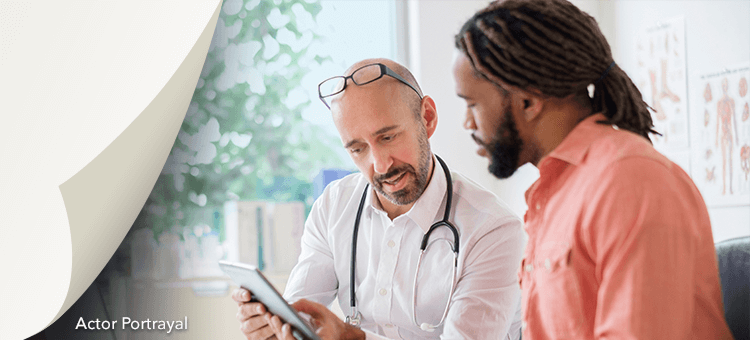 Two professionals using a tablet to discuss ordering and reimbursement options for DEFINITY®, enhancing operational efficiency